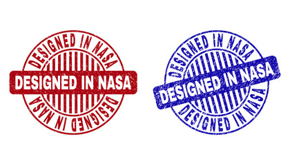 Grunge DESIGNED IN NASA round stamp seals isolated on a white background. Round seals with grunge texture in red and blue colors.