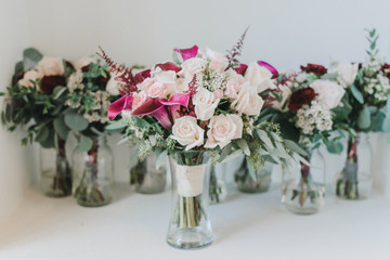 Pink roses and Calla Lily bridal bouquets on white background