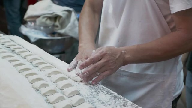 Slow motion of thresh flour for fried Chinese breadstick / doughnut cooking