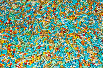 Many colorful medicines expire on cement floor
