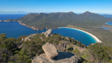 a wide angle view of wineglass bay from mt amos