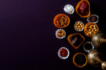 Eid Mubarak. Different iftar sweets. Celebrating Eid Al Adha. Islamic traditional holiday. Eid al-Fitr. Holly month Ramadan. Middle Eastern religious holiday. Dried date fruit. Flat lay, top view.