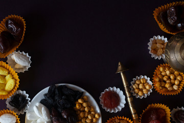 Eid Mubarak. Different iftar sweets. Celebrating Eid Al Adha. Islamic traditional holiday. Eid al-Fitr. Holly month Ramadan. Middle Eastern religious holiday. Dried date fruit. Flat lay, top view.