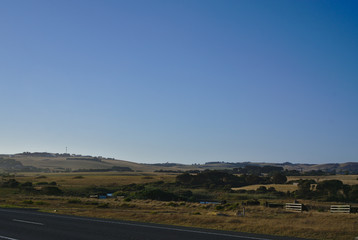 Hills and trees with blue sky in background