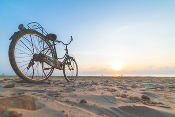 Fototapeta premium Bicycle on the beach at sunset