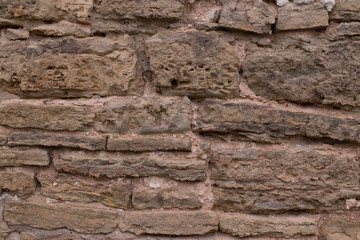 close view of the old stone brick wall of the castle