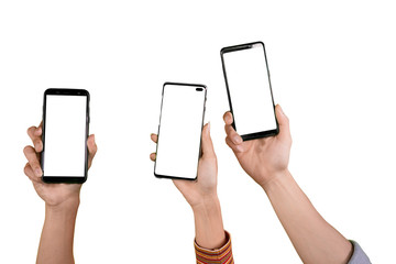 Hands of three people raise their phones on studio
