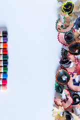 Colored pencils and trash on white paper