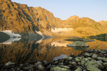 Mountains mirror reflection in the lake. Amazing mountain landscape. Altai. Alla-Askyr lake