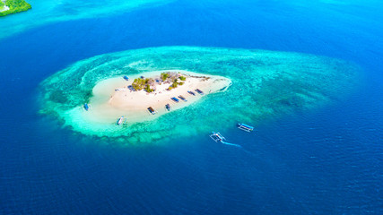 Fototapeta na wymiar Small island with white sand in Bali