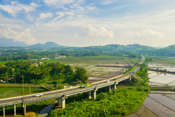 Trans-Java Toll Way bridge with farmland