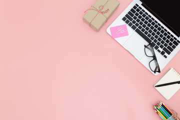 Flat lay office workspace with blank laptop, top view laptop background and copy space on pink background, Above view shot of laptop background, Laptop background