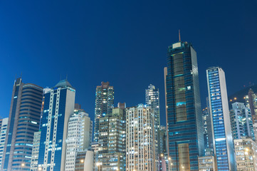high rise building and skyline of Hong Kong city at night