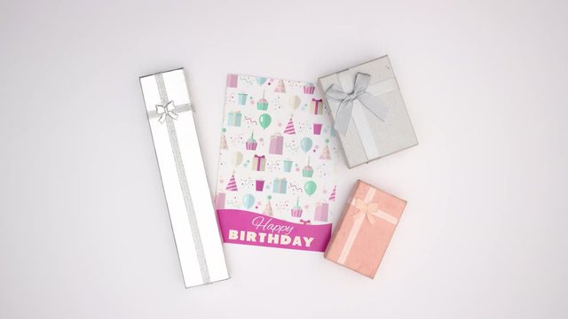 Birthday card and presents on white background - Stop motion 