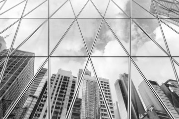 Reflection of urban skyline on modern office building