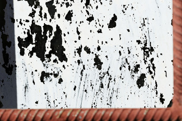 Old painted window behind iron bar close up. Grunge background