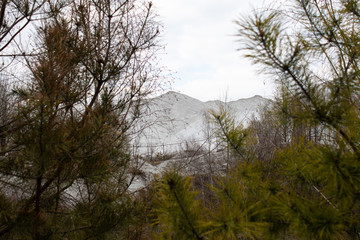 The results of the chemical plant. Mountains of chemical waste. Environmental pollution.