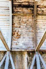 Wooden construction under the bridge