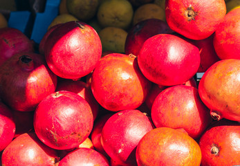 Ripe pomegranate fruits in the fruit market of Catania, Sicily, Italy.