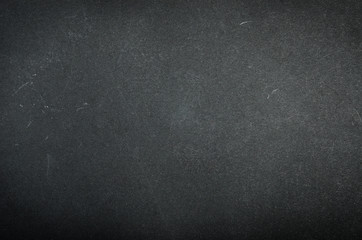 Black paper texture with scuffs and scratches.