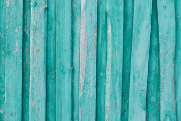 Fototapeta na wymiar Old wooden background of boards with cracked and peeling paint. Wooden texture