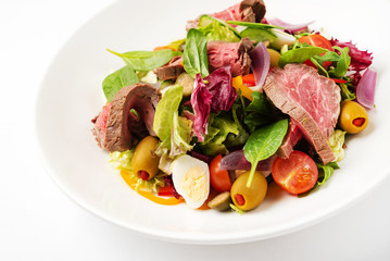 Thai grilled beef salad on the white plate