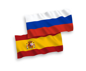 National vector fabric wave flags of Spain and Russia isolated on white background. 1 to 2 proportion.