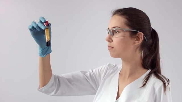 Doctor cosmetologist checks quality of centrifuged blood
