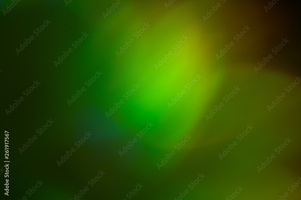 Wall mural blurred green and yellow lights. bokeh abstract background with lens flare glow effect.