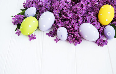 Spring lilac flowers and easter eggs