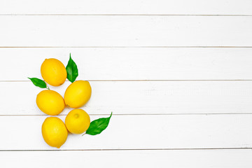 fresh lemons on wooden table.