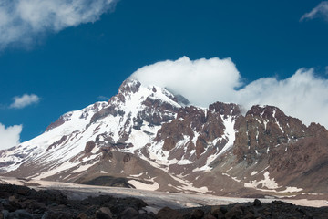 Kazbegi, Georgia - Jun 29 2018: Mount Kazbek (5047m). a famous landscape in Kazbegi, Mtskheta-Mtianeti, Georgia.