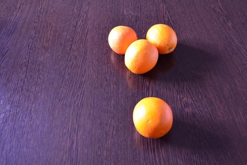 Oranges on the dining table.
