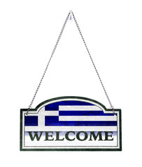 Greece welcomes you! Old metal sign isolated