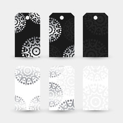 Silver star shape motif. Labels collection with ornaments on the white and black background.