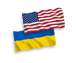 National vector fabric wave flags of Ukraine and USA isolated on white background. 1 to 2 proportion.