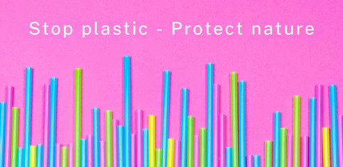 Banner of colorful plastic straws with the words stop plastic - protect nature on pink background