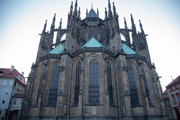 Fototapeta na wymiar Close-up view of St. Vitus Cathedral against the blue sky. Prague, Czech Republic