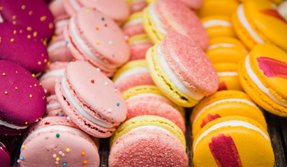 Bright colorful beautiful macaroons with tender and flavorful cream. The contrast of colors and the ideal form, selective focus
