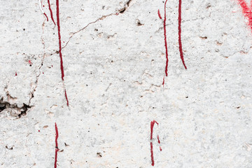 Wall fragment with scratches and cracks