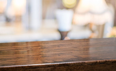 wood table at restaurant blur background.Empty perspective hardwood bar with blur coffee shop with...