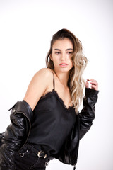 Beauty girl in Black leather jacket studio shoot