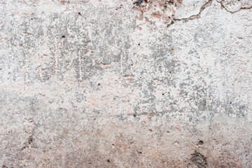 Wall fragment with scratches and cracks