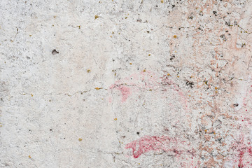 Wall fragment with scratches and cracks