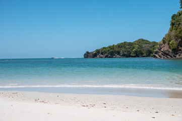 Beautiful tropical sea with mountain and white beach