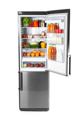Big modern fridge with fresh products on white background