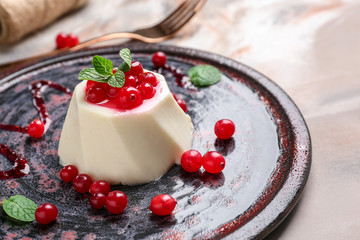 Tasty panna cotta on plate, closeup