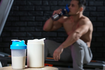 Protein shake on table against dark background