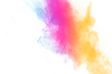 Colorful powder explosion on white background.Pastel color dust particle splashing.