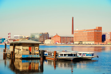Naklejka premium Old Marina for yachts and boats on the city river on a Sunny day.